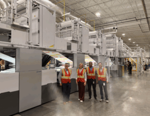 Ed Curtis, VP of Operations; Emily Leonczyk, PPC; Moolay Teklemariam, Flexo Print Manager; and Ben Walter, Manufacturing Site Leader, proudly stand in front of their new Heidelberg Boardmaster press, marking an exciting step forward in innovation and production.